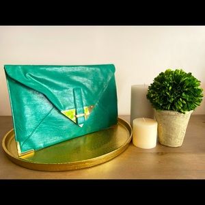 Oversized Green clutch designed by ASOS